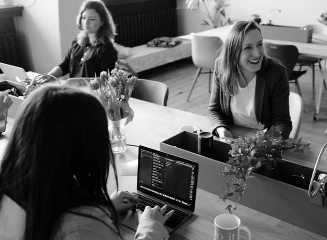 An image of people working in a office